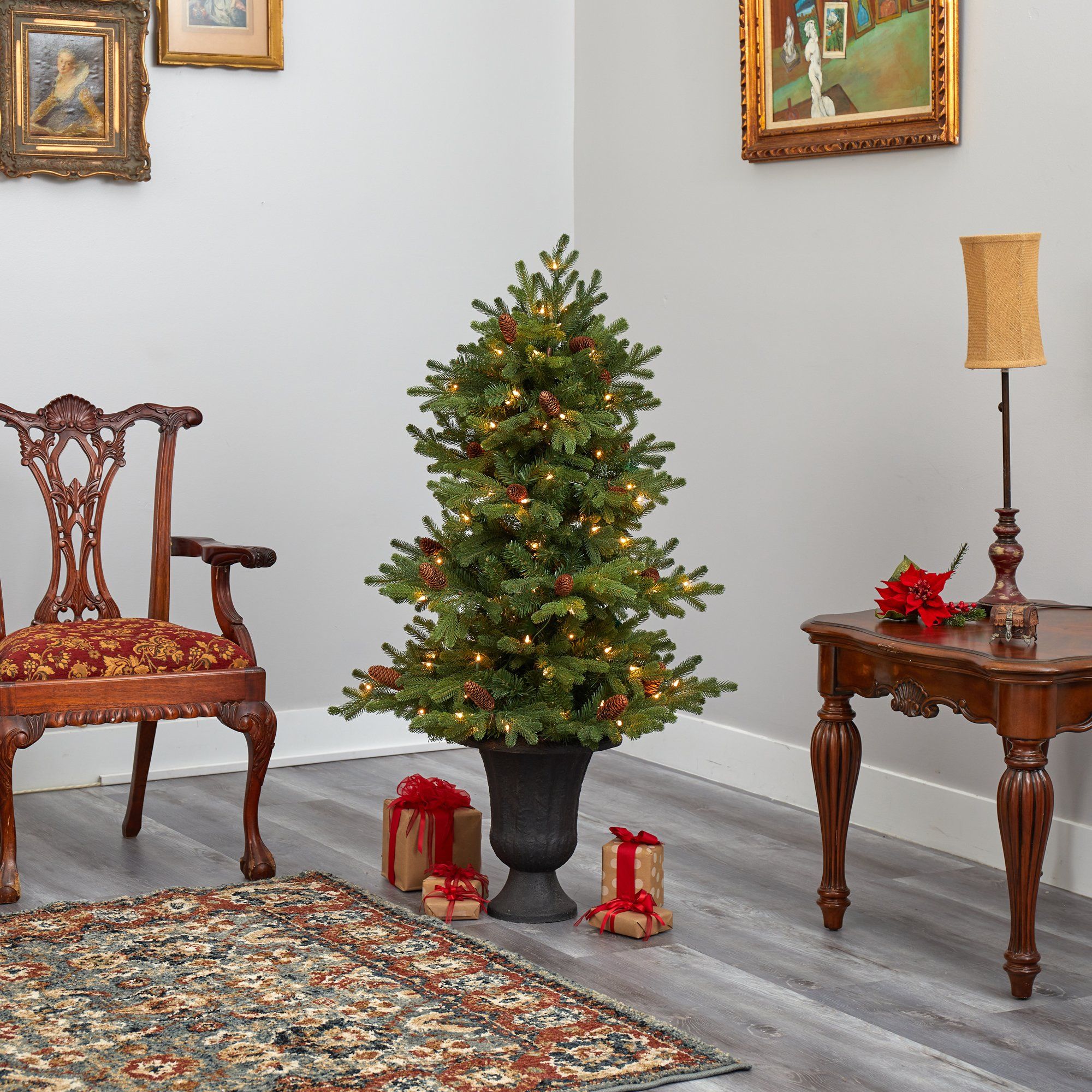 4.5’ Yukon Mountain Fir Artificial Christmas Tree with 100 Clear Lights, Pine Cones and 386 Bendable Branches in Charcoal Planter